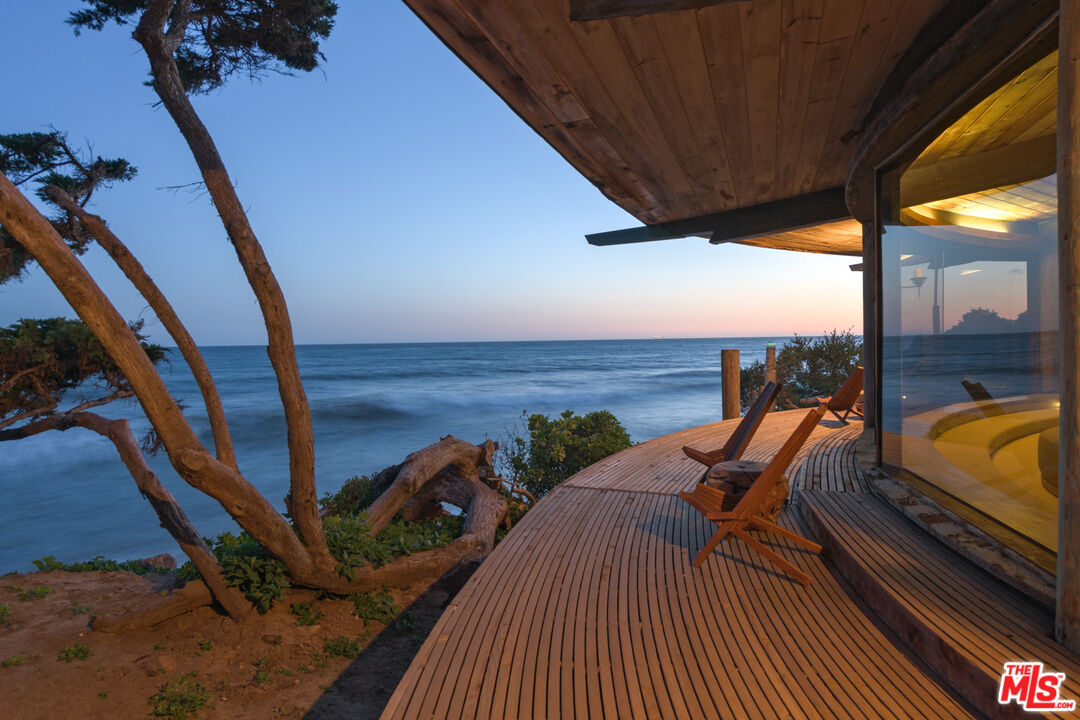 33604 Pacific Coast Highway Malibu, CA 90265 - Photo 41 of 46 a view of a balcony with chair and wooden floor