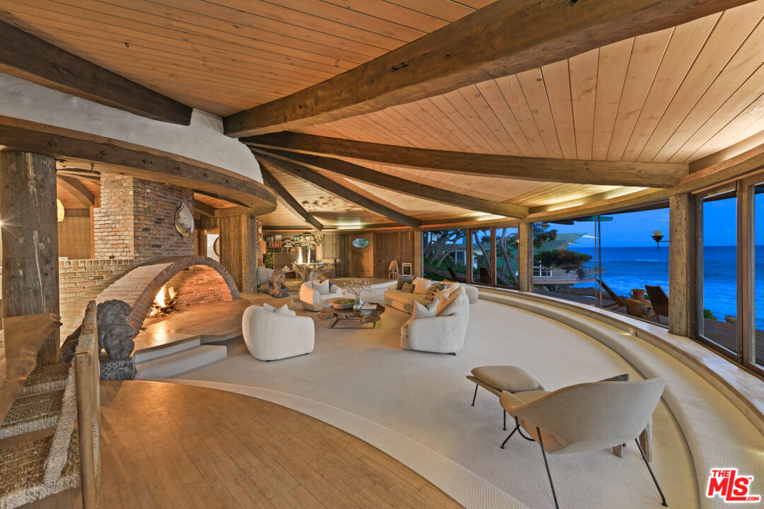 33604 Pacific Coast Highway Malibu, CA 90265 - Photo 44 of 46 a room with lot of furniture and a chandelier