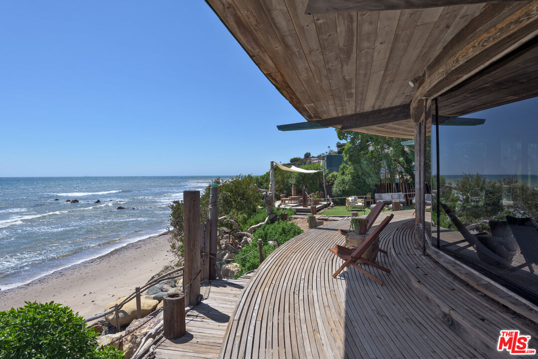 33604 Pacific Coast Highway Malibu, CA 90265 - Photo 7 of 46 a view of a balcony with chair and wooden floor
