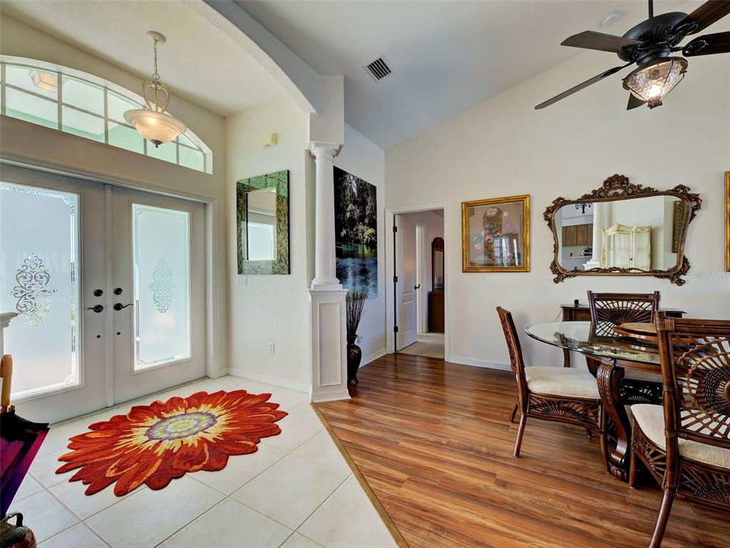 77 Medalist Road Rotonda West, FL 33947 - Photo 11 of 81 a bedroom with a bed and wooden floor