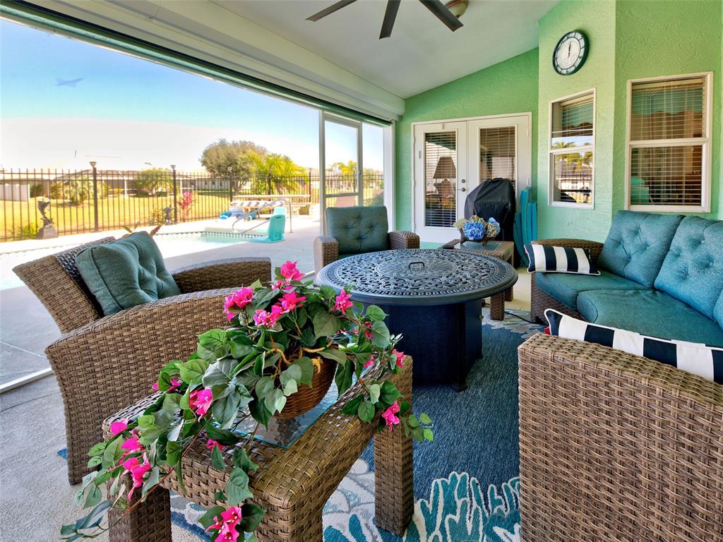 77 Medalist Road Rotonda West, FL 33947 - Photo 19 of 81 a living room filled with furniture and a large window
