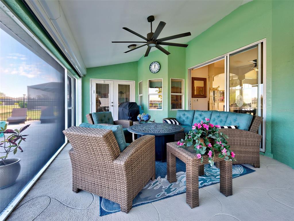 77 Medalist Road Rotonda West, FL 33947 - Photo 20 of 81 a living room with furniture and flowers