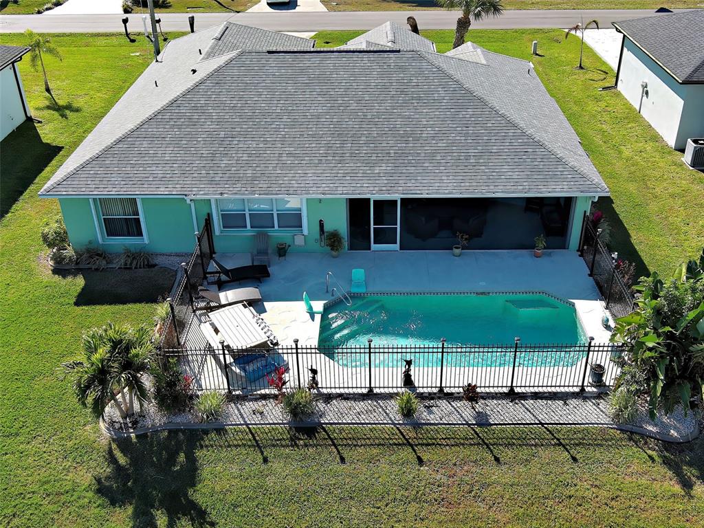 77 Medalist Road Rotonda West, FL 33947 - Photo 3 of 81 an aerial view of a house with swimming pool and patio