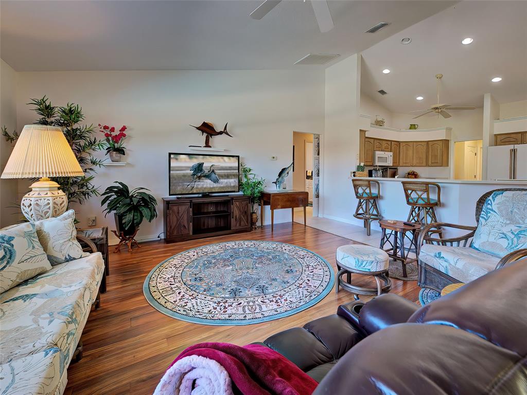 77 Medalist Road Rotonda West, FL 33947 - Photo 32 of 81 a living room with furniture and a wooden floor