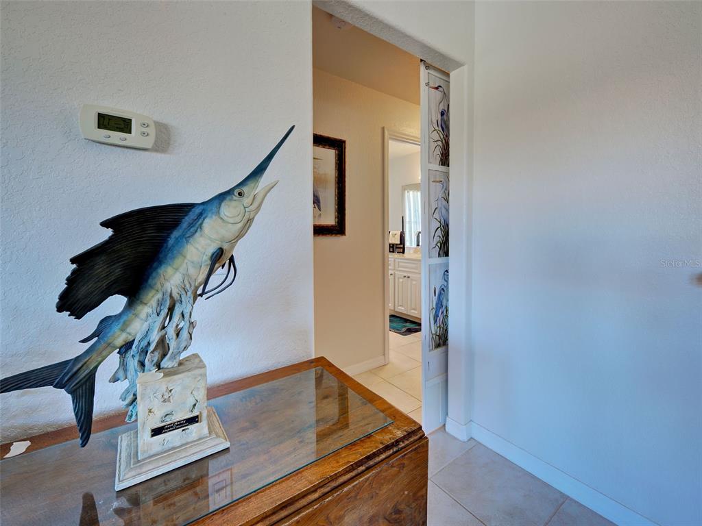 77 Medalist Road Rotonda West, FL 33947 - Photo 35 of 81 a view of entryway and hall with wooden floor