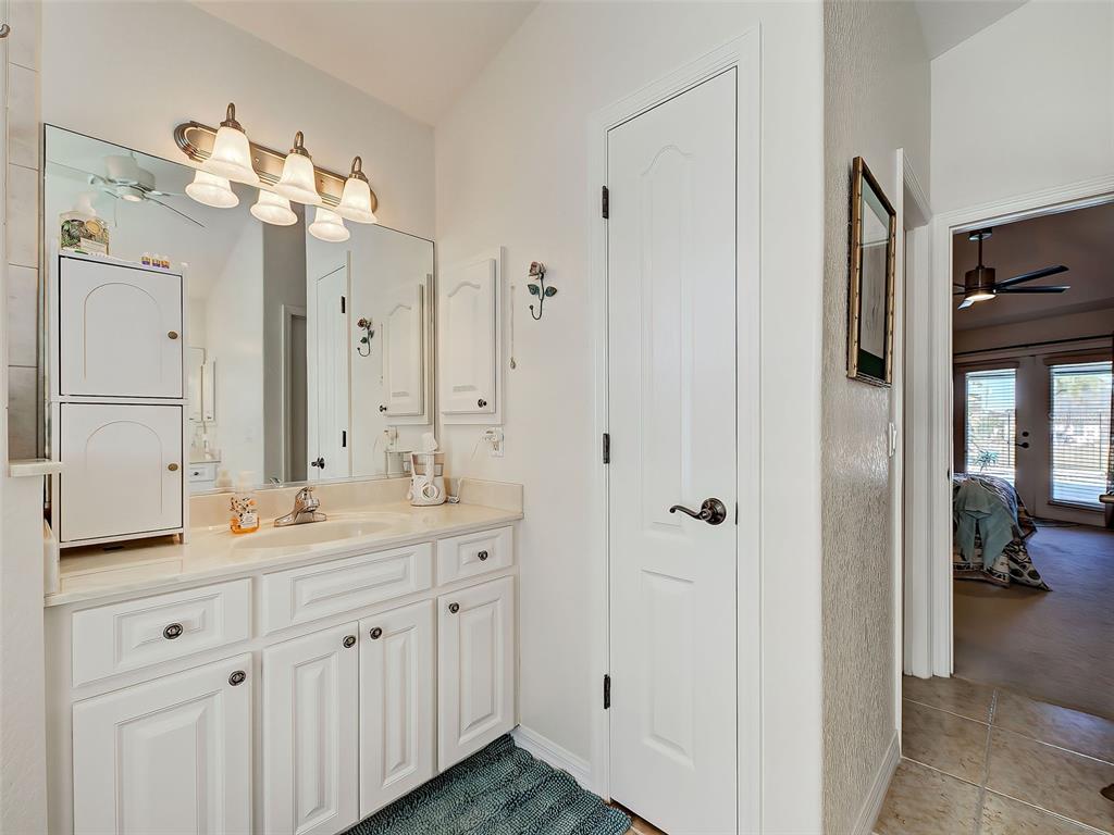 77 Medalist Road Rotonda West, FL 33947 - Photo 42 of 81 a bathroom with a double vanity sink mirror and