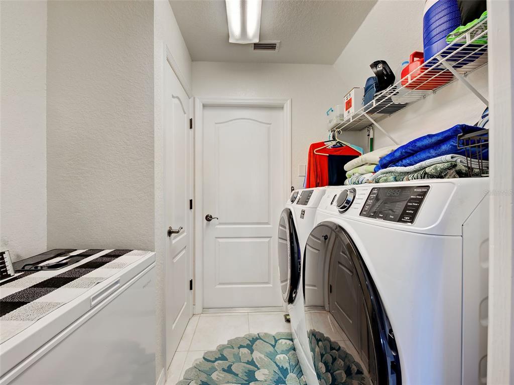 77 Medalist Road Rotonda West, FL 33947 - Photo 57 of 81 a utility room with dryer and washer