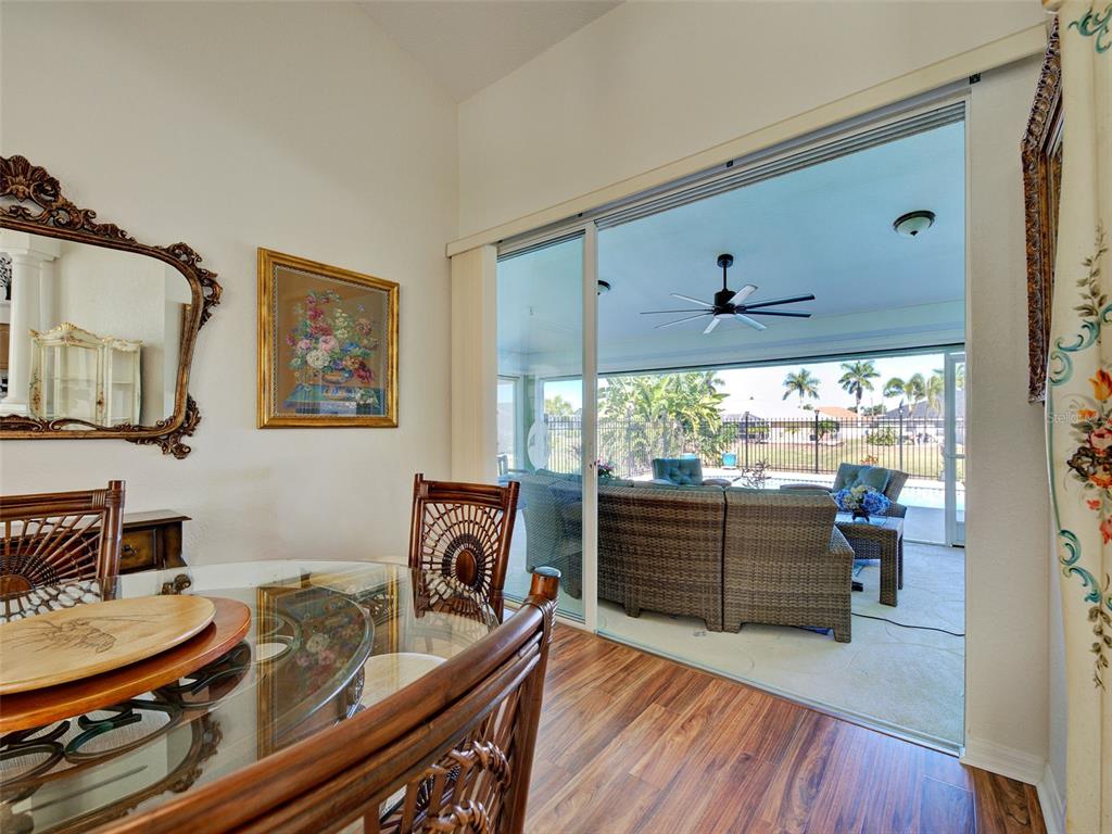 77 Medalist Road Rotonda West, FL 33947 - Photo 59 of 81 a living room with furniture and a large window