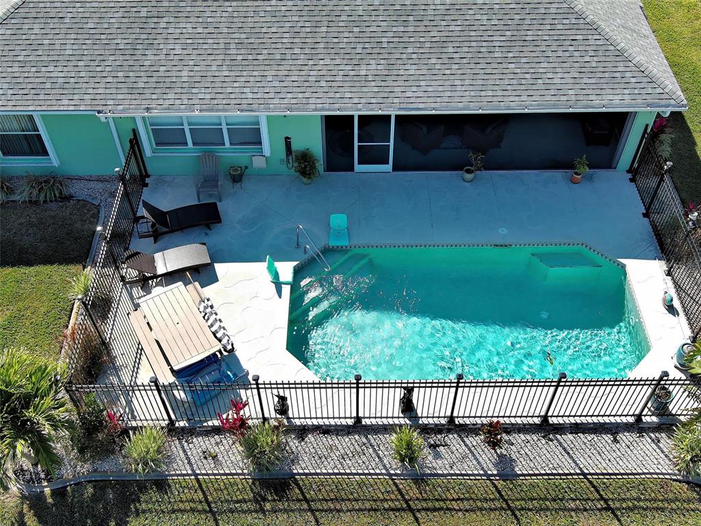 77 Medalist Road Rotonda West, FL 33947 - Photo 73 of 81 a view of house with backyard and porch