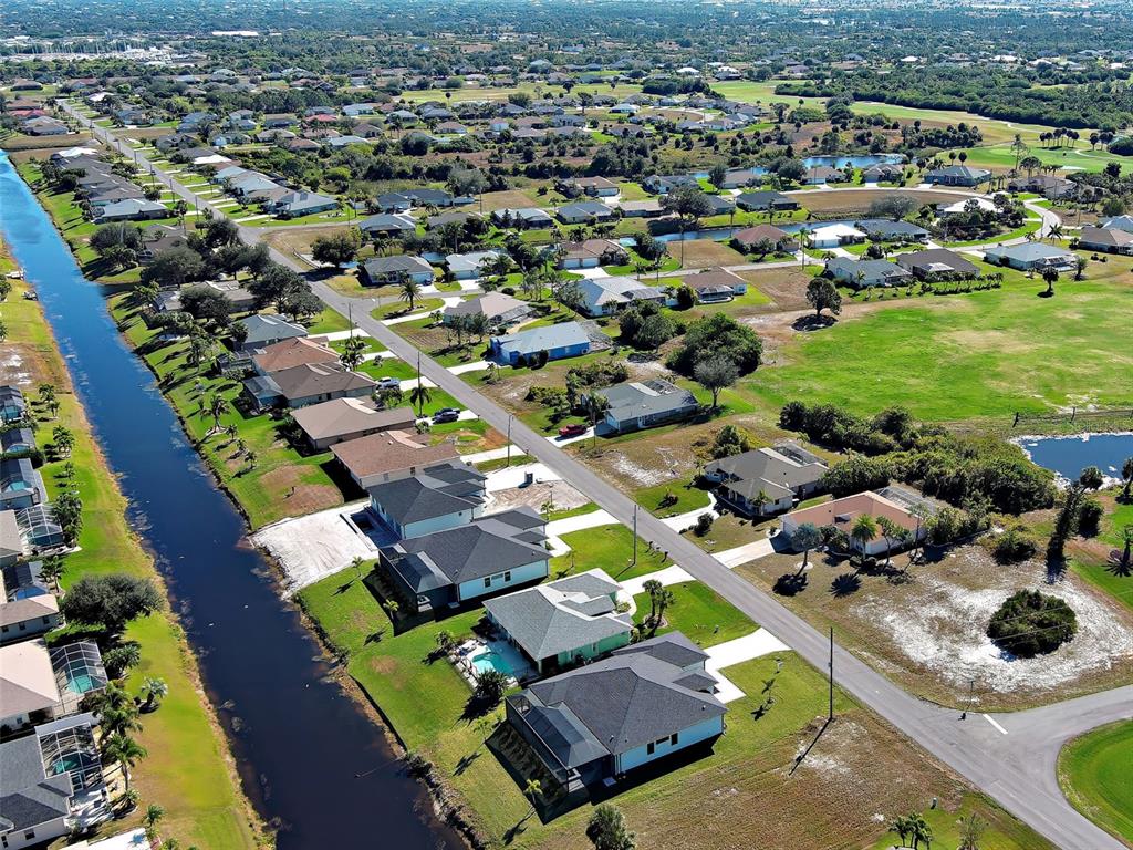 77 Medalist Road Rotonda West, FL 33947 - Photo 76 of 81 an aerial view of a house with a garden