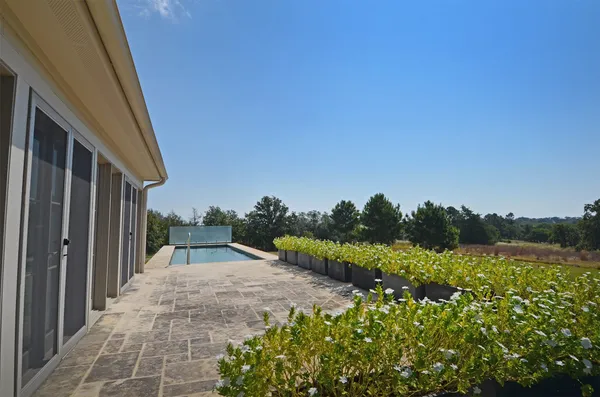 a view of a house with a backyard
