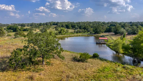 a view of a lake with a yard
