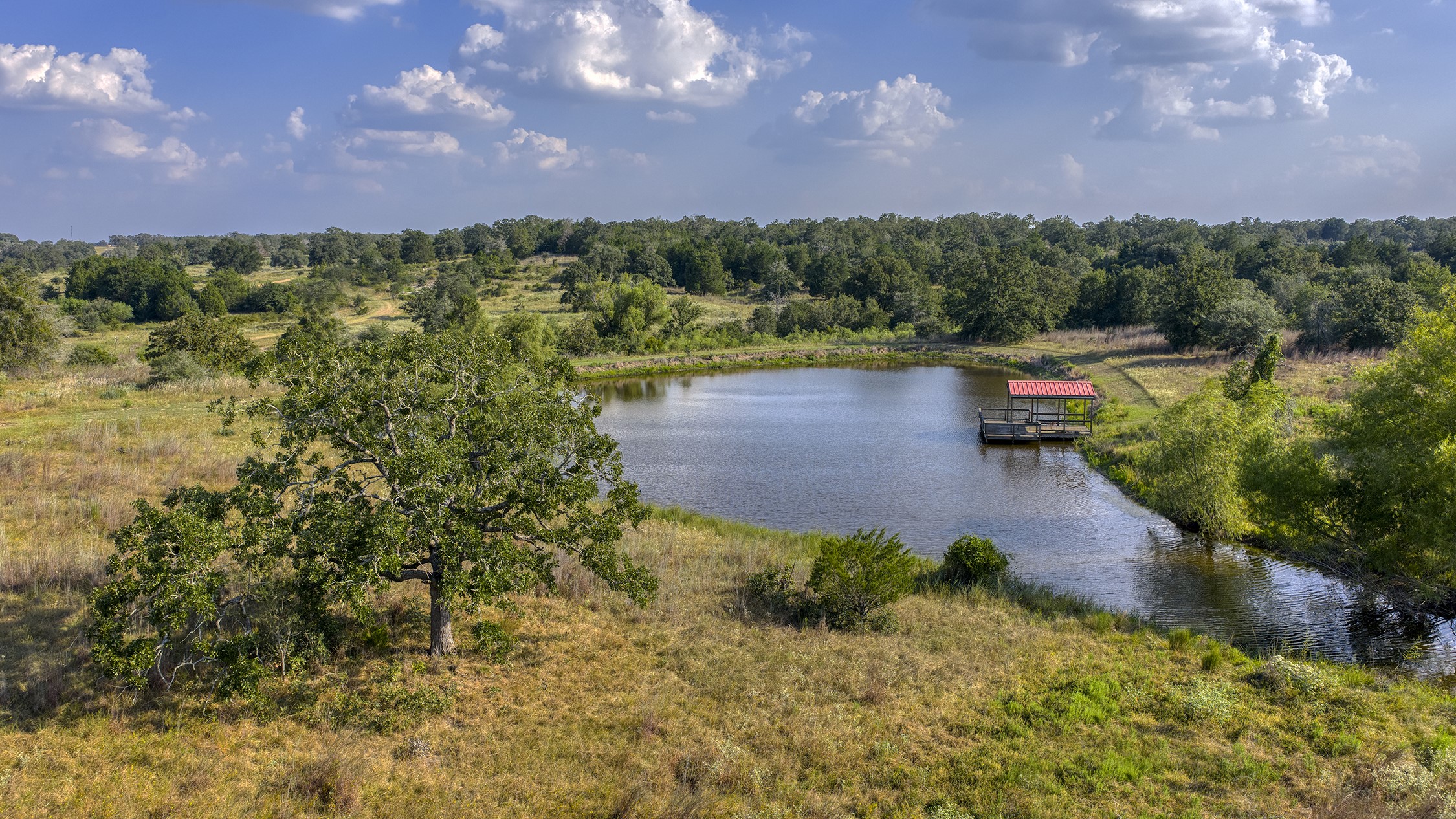 1880 Schoenberg Road Carmine, TX 78932 - Photo 29 of 36 a view of a lake with a yard