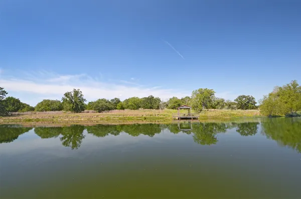 a view of lake with houses in the back