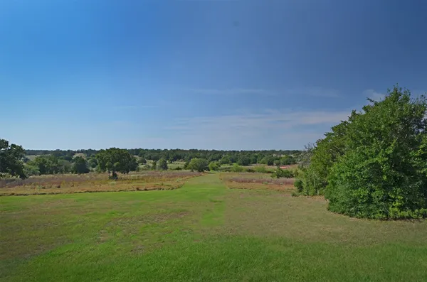 a view of a lake with houses in the background