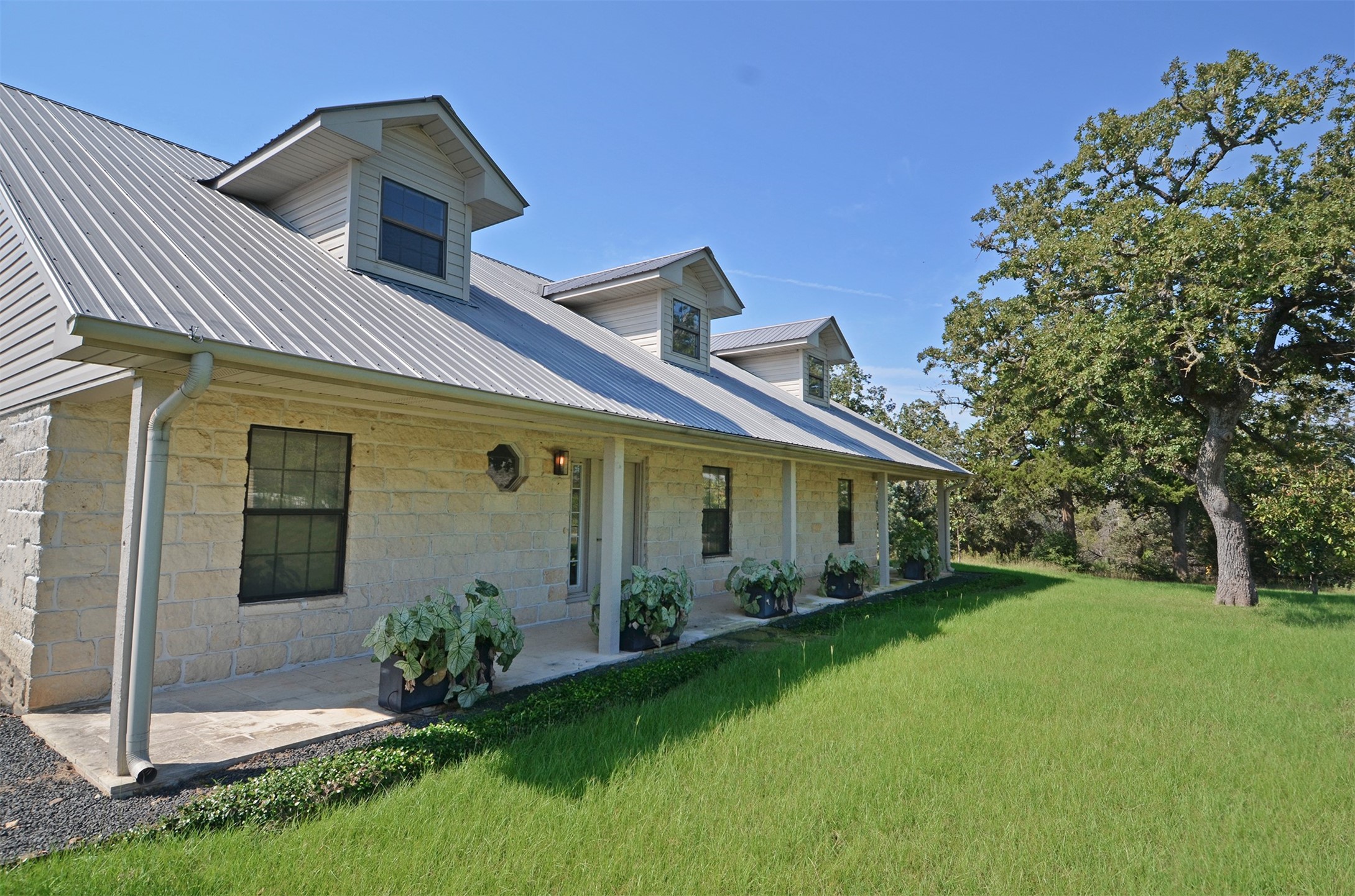 1880 Schoenberg Road Carmine, TX 78932 - Photo 4 of 36 a front view of a house with garden