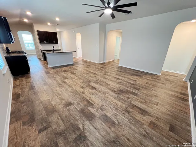 a view of a livingroom with furniture and a flat screen tv