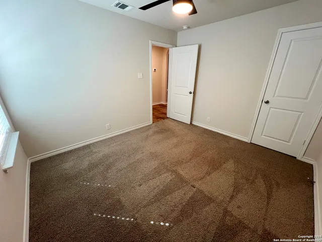 an empty room with a bathroom