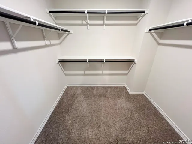 a view of an empty walk in closet