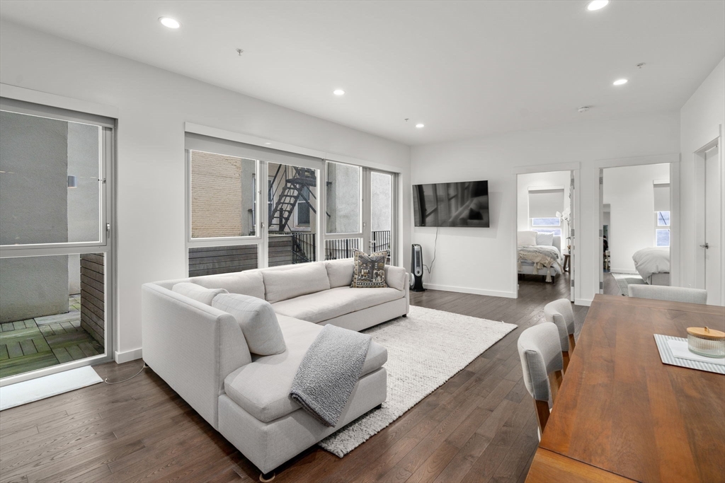 126 Salem Street, Unit 3 Boston, MA 02113 - Photo 2 of 22 a living room with furniture and a flat screen tv