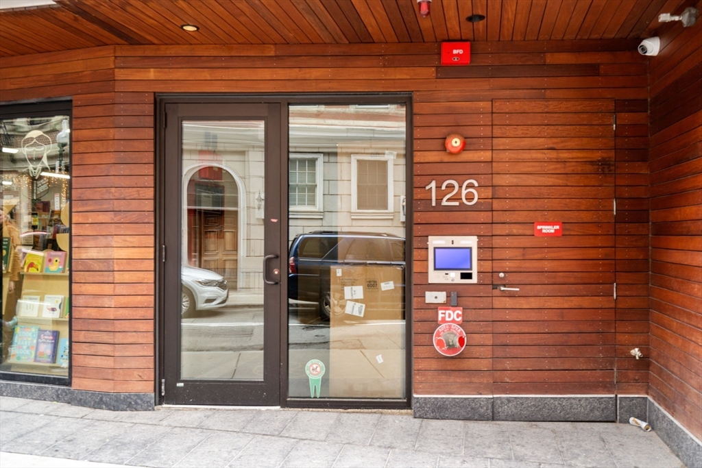 126 Salem Street, Unit 3 Boston, MA 02113 - Photo 21 of 22 a front view of a building with a glass door