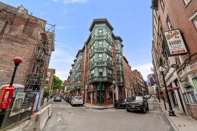 a view of a street with cars