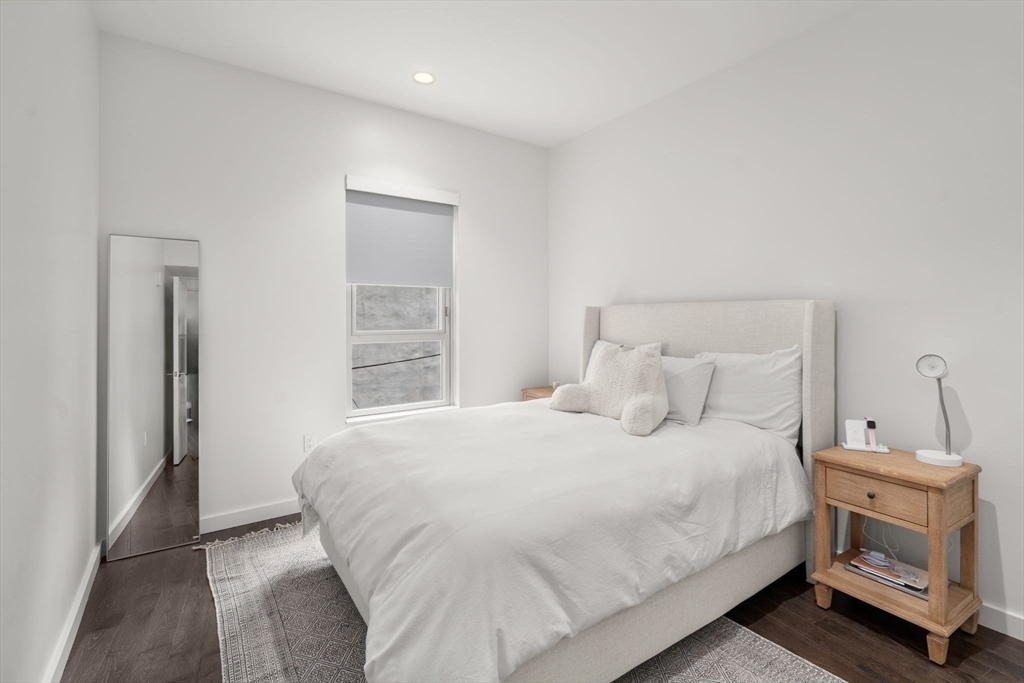 126 Salem Street, Unit 3 Boston, MA 02113 - Photo 6 of 22 a bedroom with a bed and a fireplace