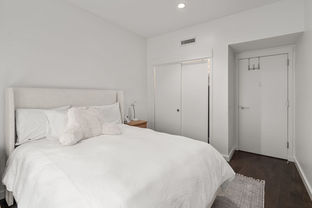 126 Salem Street, Unit 3 Boston, MA 02113 - Photo 7 of 22 a bedroom with a bed and a night stand