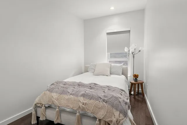 a bedroom with a bed and a table