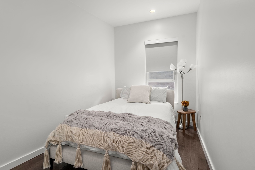 126 Salem Street, Unit 3 Boston, MA 02113 - Photo 8 of 22 a bedroom with a bed and a table