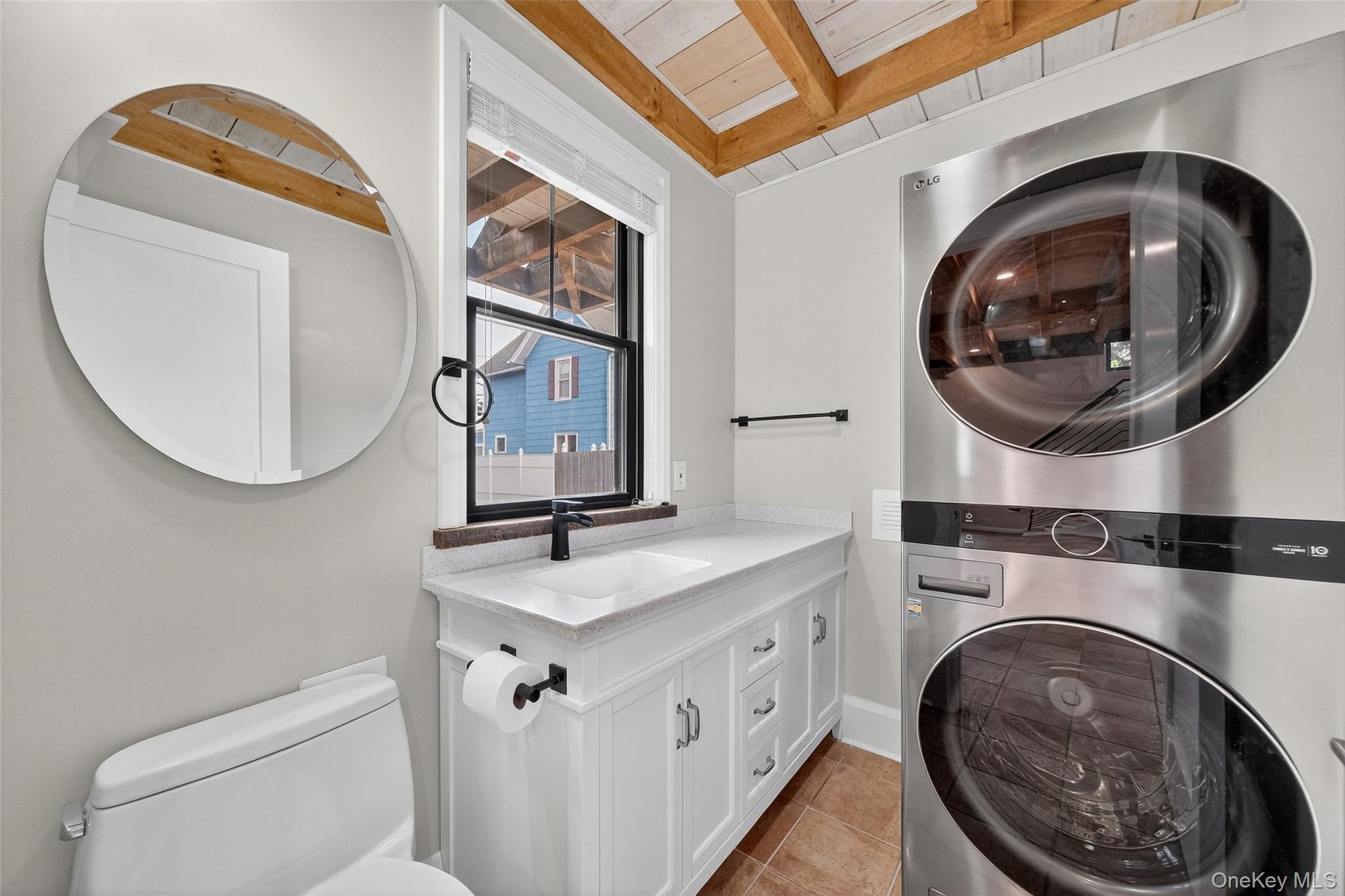 52 Ackerman Street, Unit 50 5 Beacon, NY 12508 - Photo 12 of 23 a bathroom with a sink and a mirror