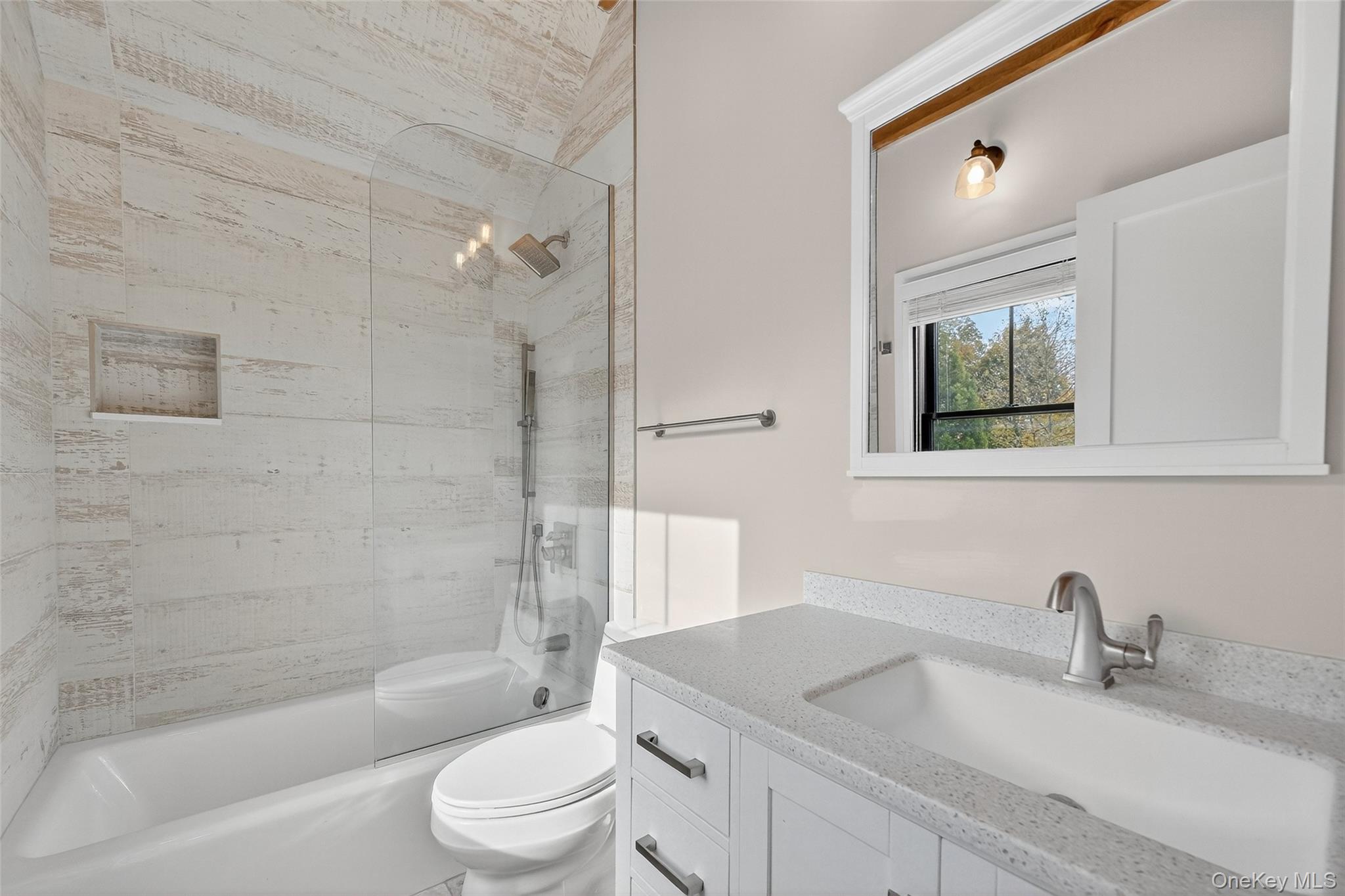 52 Ackerman Street, Unit 50 5 Beacon, NY 12508 - Photo 17 of 23 a bathroom with a sink a toilet and bathtub