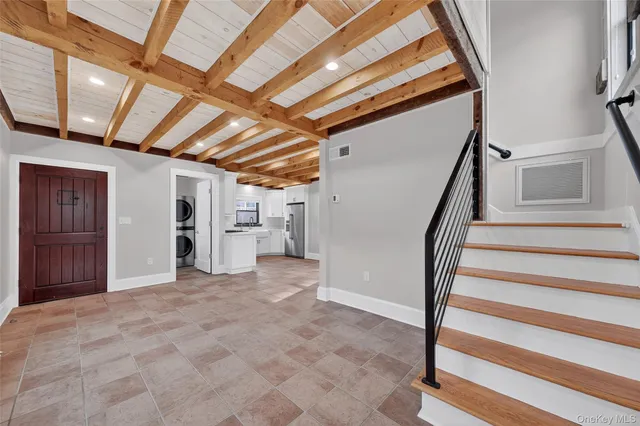 a view of an empty room with stairs