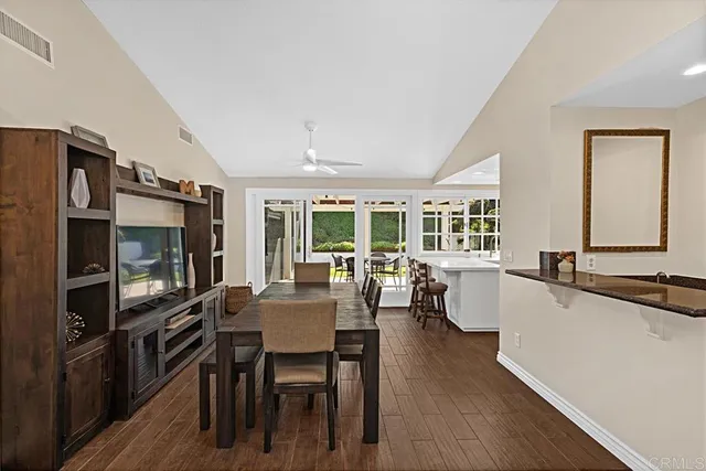 a large kitchen with a table and chairs in it