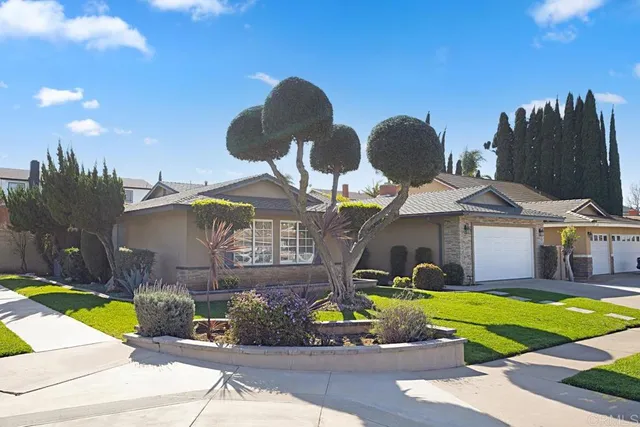 a front view of a house with swimming pool and porch