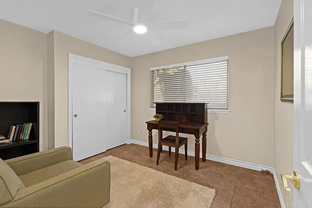 a work room with furniture and a window