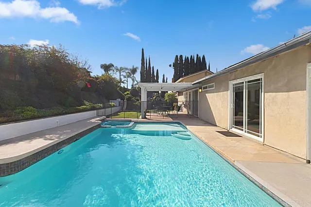 a view of a backyard with sitting area