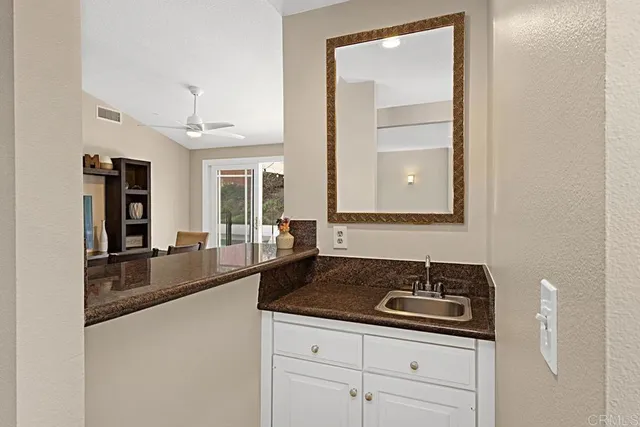 a kitchen with a sink and cabinets