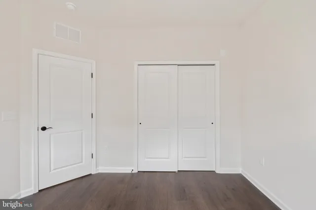 a view of room with hardwood floor
