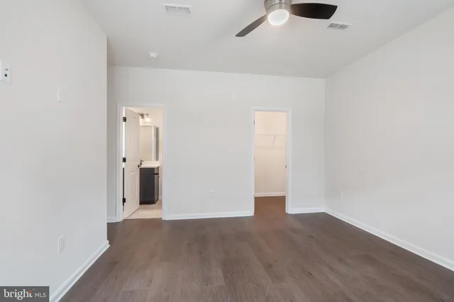 an empty room with wooden floor