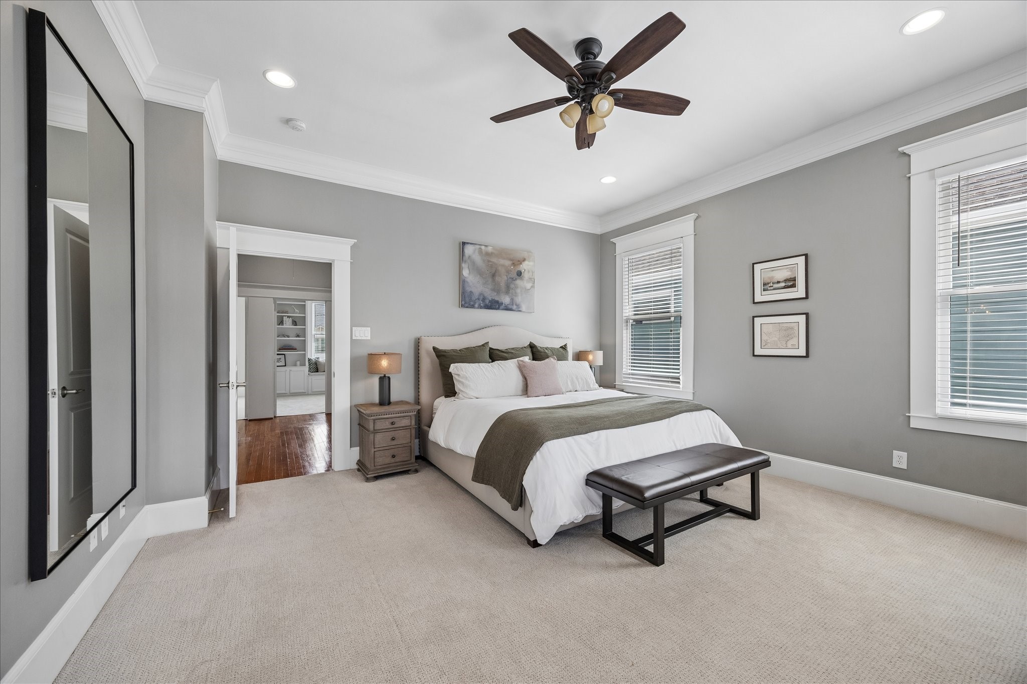 621 West 15th Street Houston, TX 77008 - Photo 19 of 37 Spacious primary bedroom with high ceilings, crown molding, ceiling fan and tons of natural light.