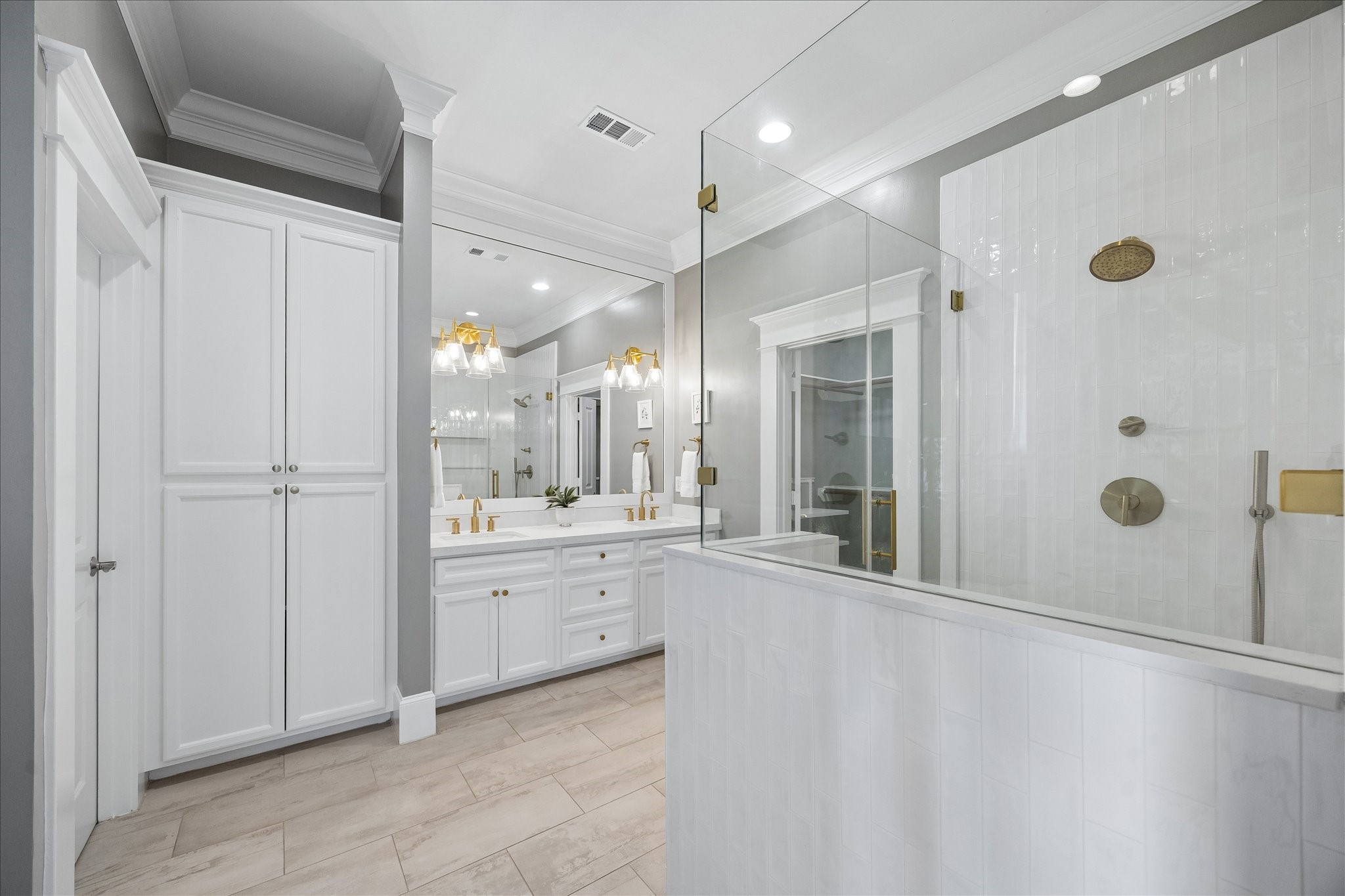 621 West 15th Street Houston, TX 77008 - Photo 23 of 37 Renovated in 2022 (per seller), this luxurious ensuite bathroom offers generous storage and creates a functional, effortless space for getting ready every day.