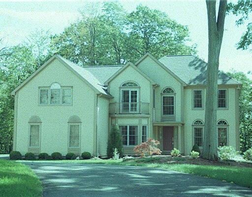 12 Cornerstone Court Ridgefield, CT 06877 - Photo 1 of 1 a front view of a house with garden