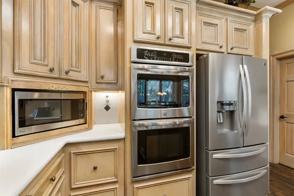 a kitchen with granite countertop stainless steel appliances and cabinets