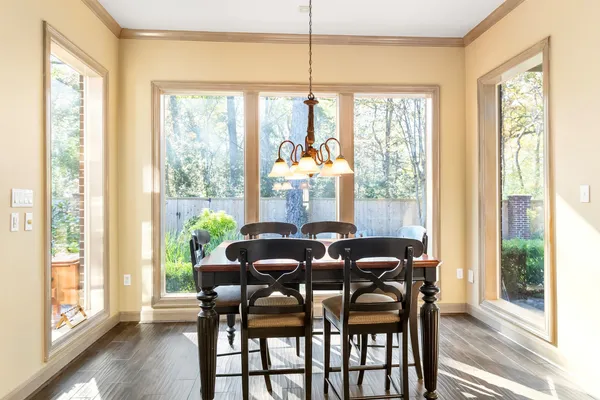 a dining room with furniture window wooden floor