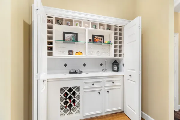 a view of kitchen cabinets with food items with white countertops