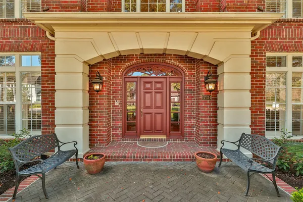 a front view of a house with outdoor seating