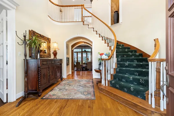 a view of living room kitchen with furniture and wooden floor