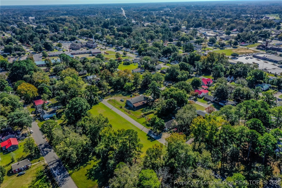 9th Street Lumberton, NC 28358 - Photo 7 of 17 an aerial view of residential house with outdoor space and trees all around