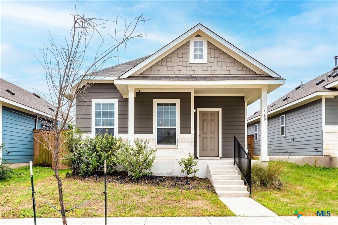 360 Spiny Lizard Lane San Marcos, TX 78666 - Photo 1 of 22 a front view of a house with a garden